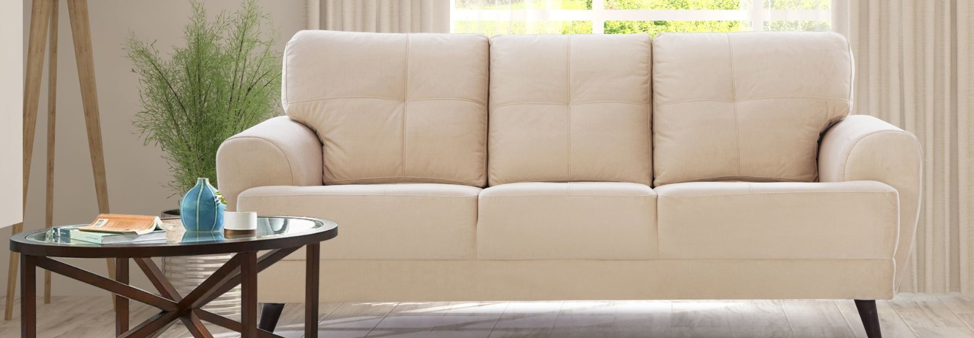 A soft beige sofa in a calm, modern room